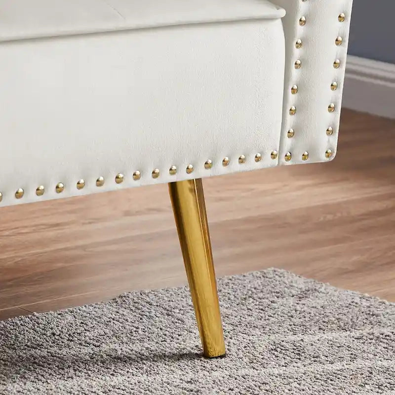 Canapé 2 places en velours capitonné avec 2 oreillers et garniture cloutée